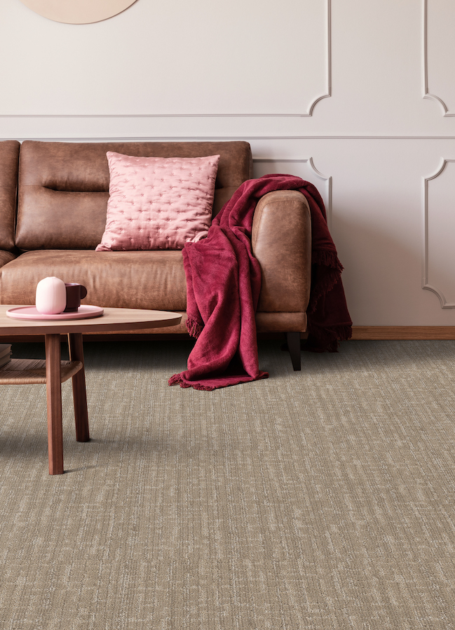 brown textured carpets in a living room with pink accents